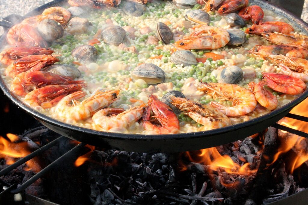 Spanish Food Guide: paella, lena, mixed, valencian, seafood, shrimp, prawn, fire, spanish food, mediterranean, rice, clams, valencian paella, paella, paella, paella, paella, paella, seafood, spanish food, spanish food