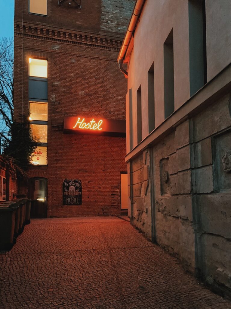 budget travel in Africa: red and white lighted store signage