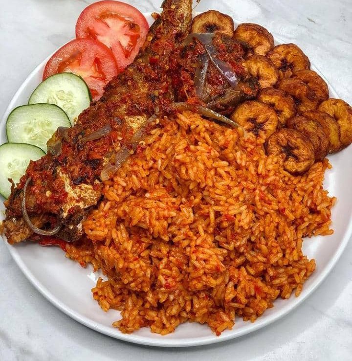 budget travel in Africa: plate with red rice, jollof rice