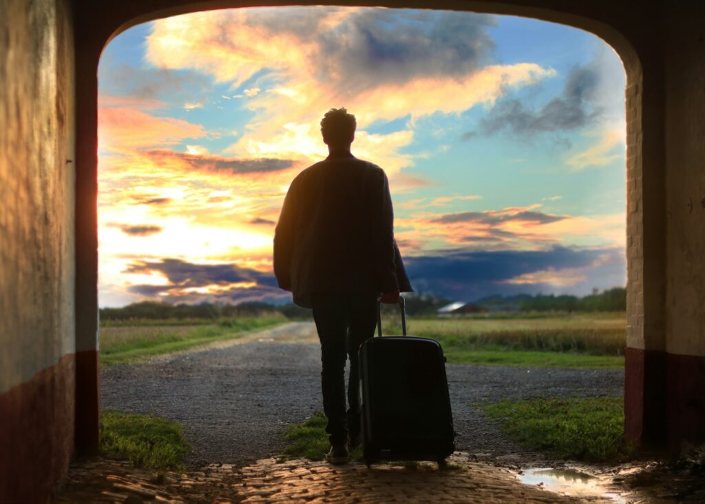 Solo Travel Safety Tips: man holding luggage photo