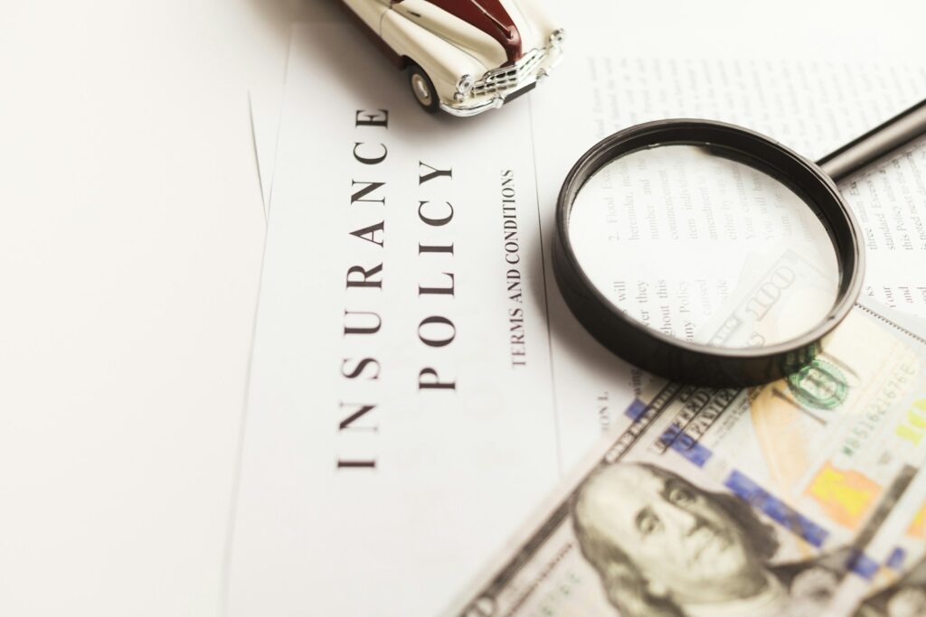 Travel Insurance Guide: a magnifying glass sitting on top of a piece of paper