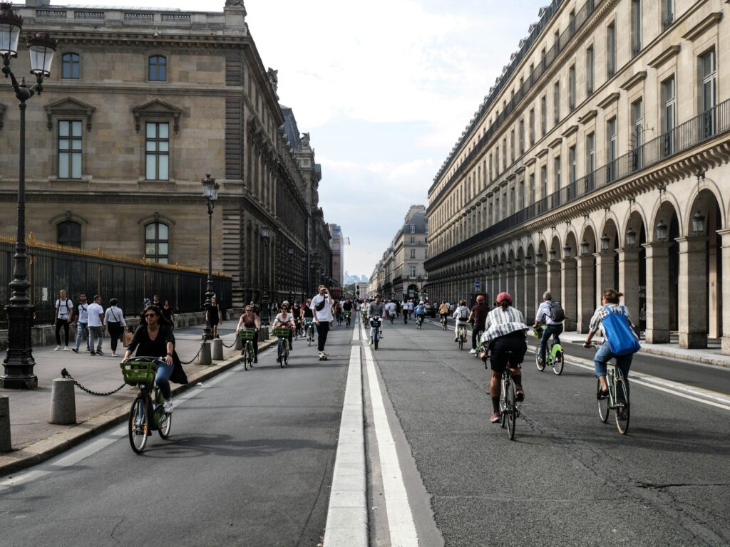 Paris on a Budget: a group of people riding bikes down a street