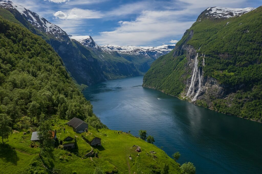 best train rides in Europe: Norwegian Fjords, a river running through a valley between mountains