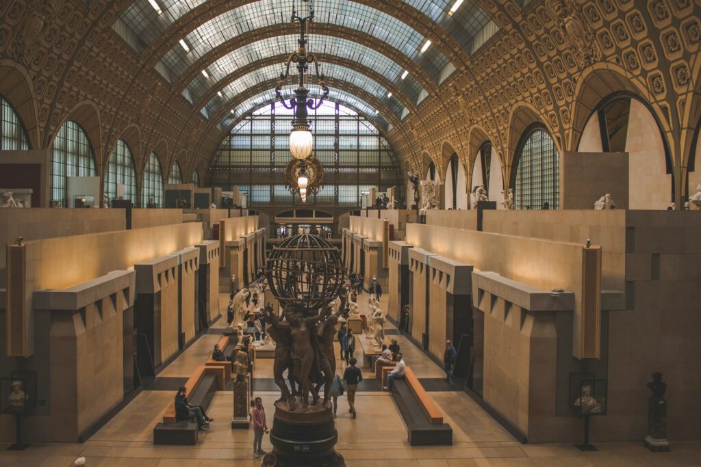 Paris on a Budget: musée d'orsay, a large building with a very tall ceiling