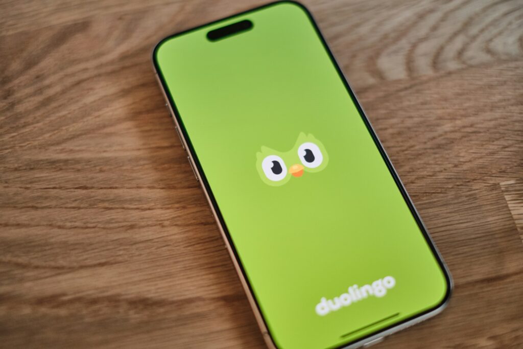 Best Travel Apps: A green phone with a face drawn on it