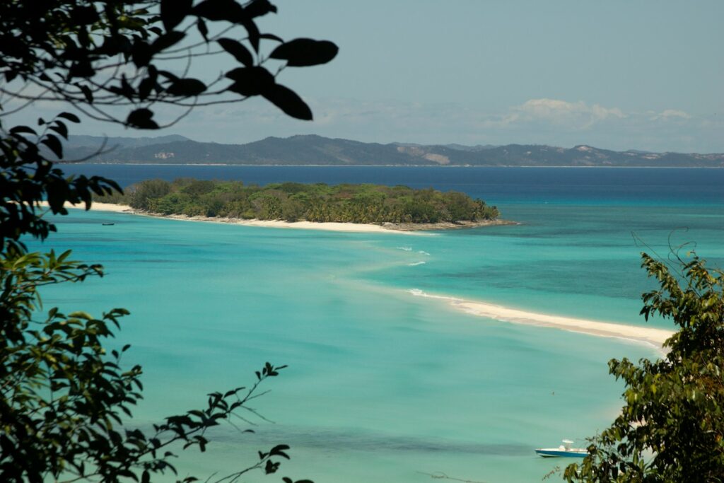 best beaches in africa: Nosy Be, green trees near body of water during daytime