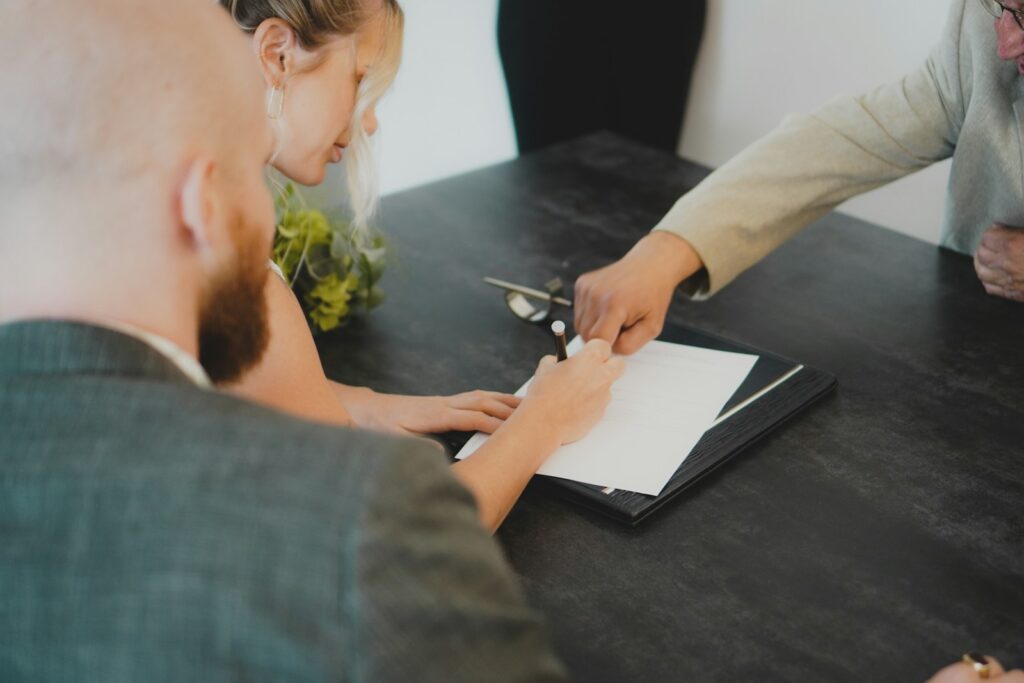 Travel Insurance Guide: a woman showing a man something on a tablet